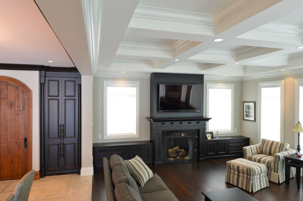 Custom cabinetry with a built-in fireplace and mantel