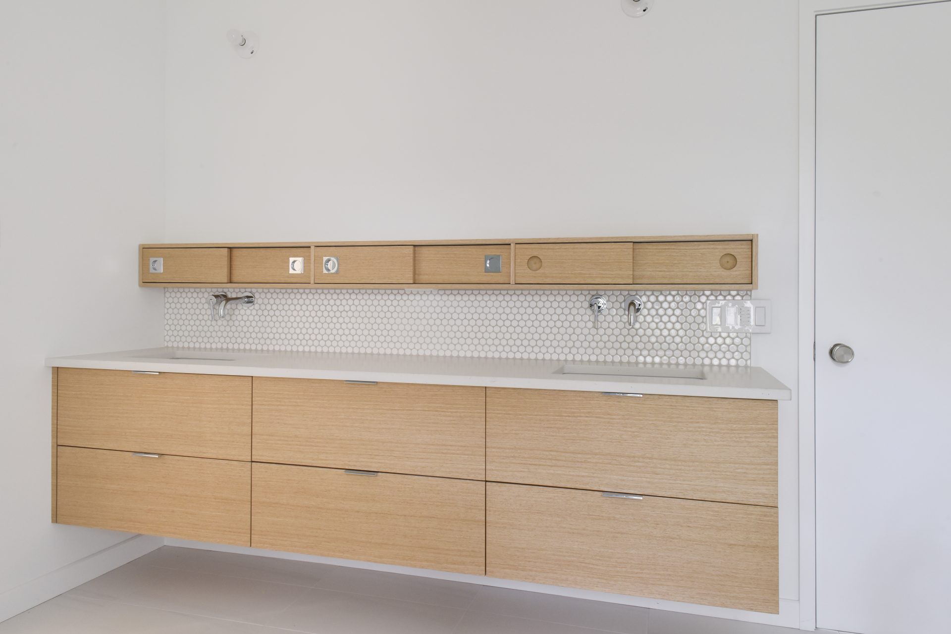 Floating vanity with double sinks.