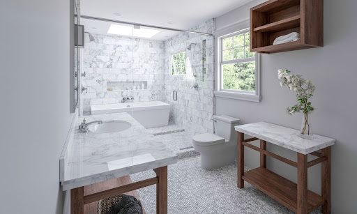 White quartz on bathroom vanity, shower, and tile flooring.