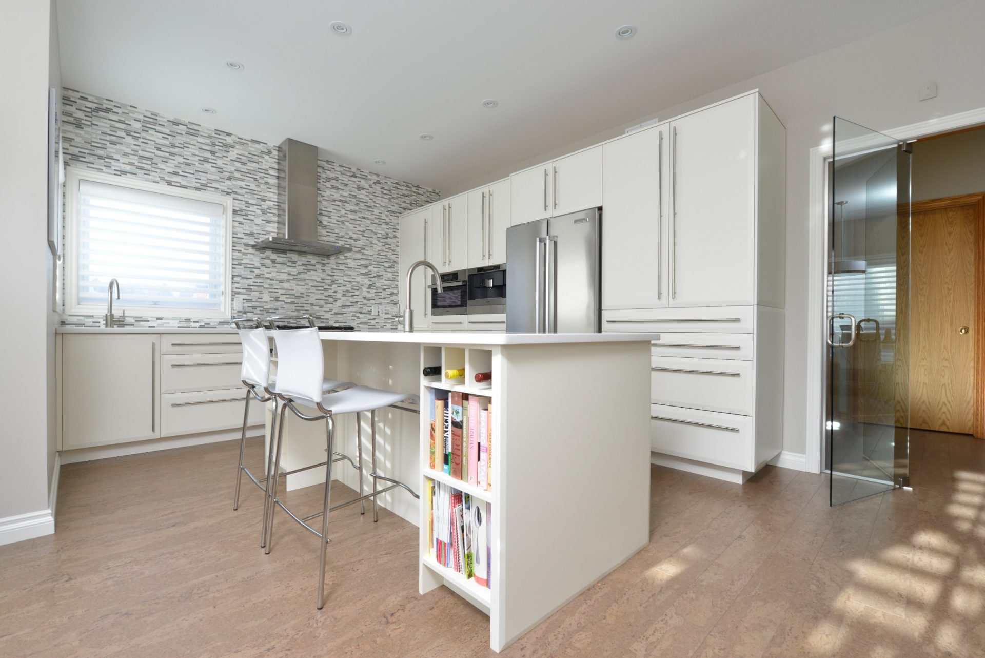Bright contemporary kitchen with sleek white cabinets