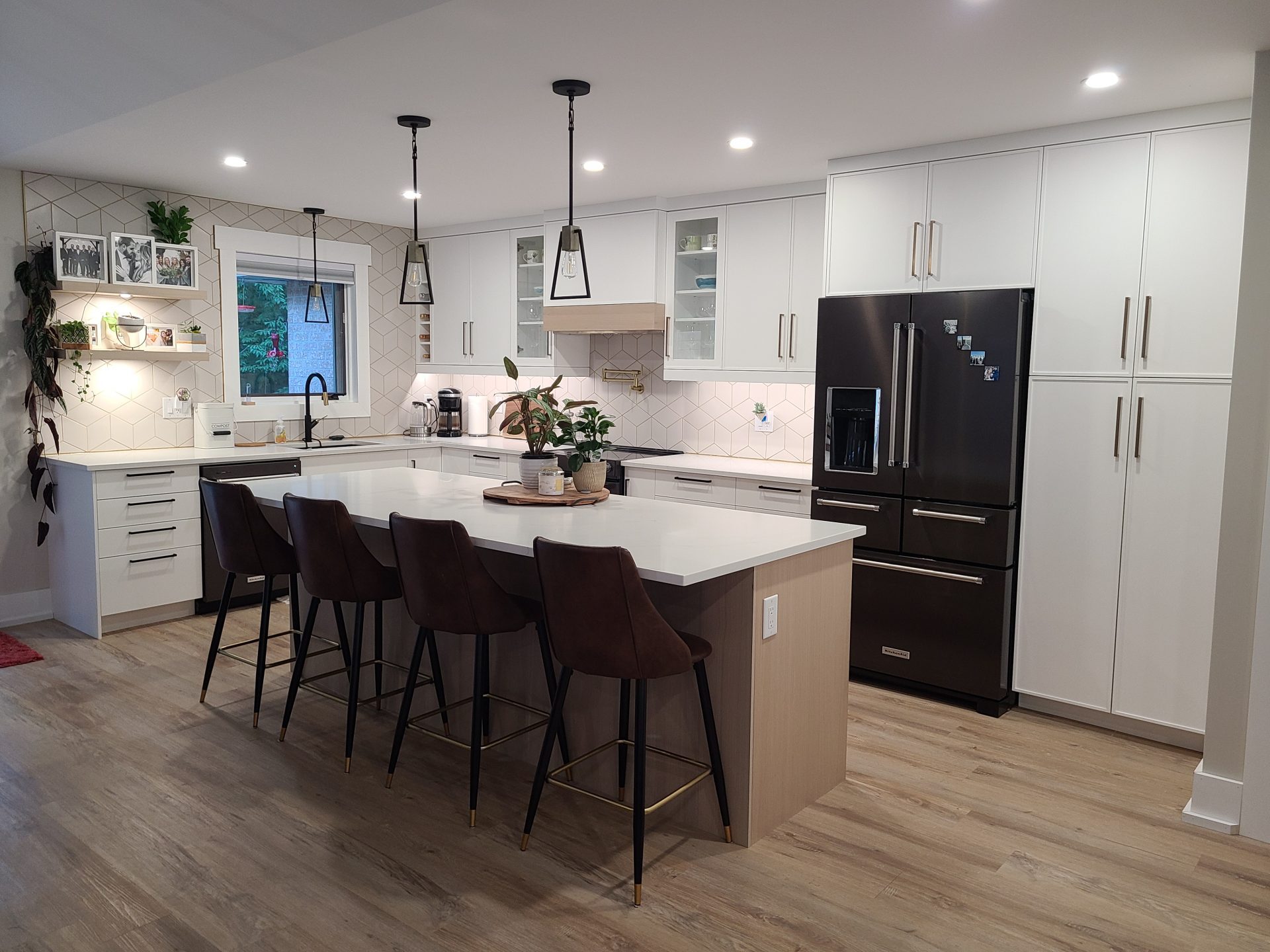 White kitchen with light wood accents.
